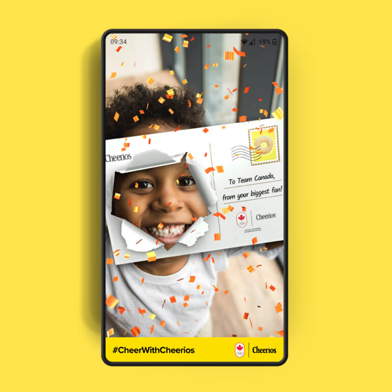 Image of a cell phone with a girl with a face filter in the middle on a yellow background